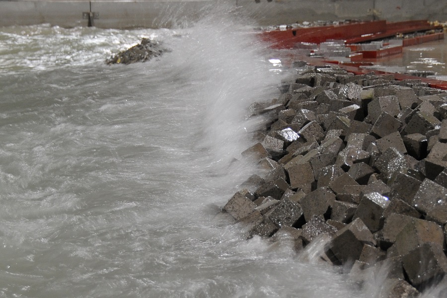 View of waves crashing on modelled breakwater 