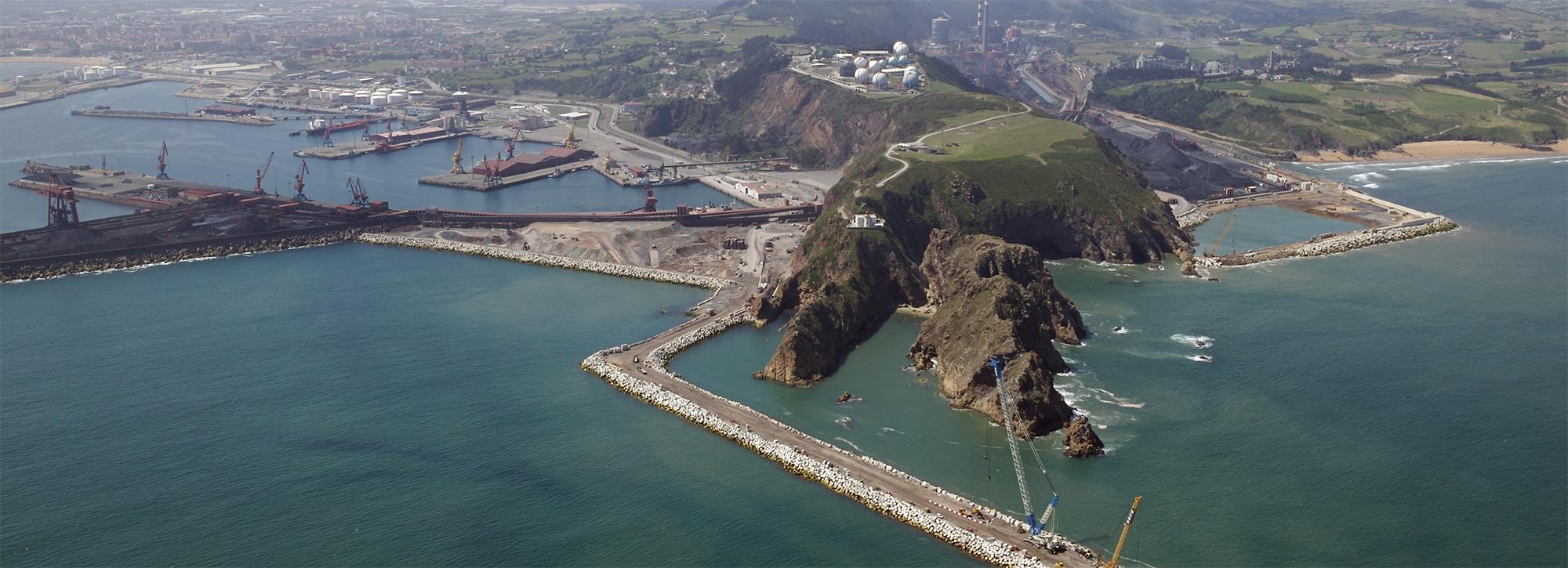 Aerial view of port of Gijon in Spain and its marine facilities, such as breakwater