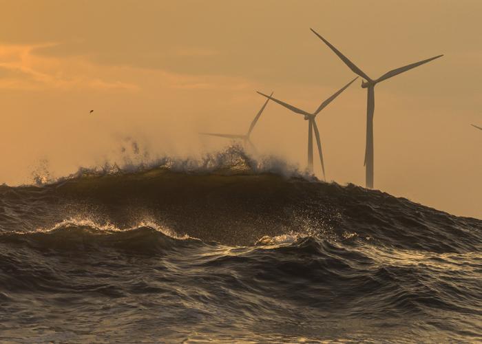 View of offshore wind farm in stormy weather