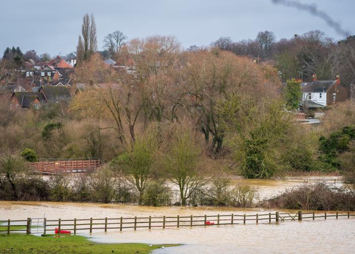 flooded river in Northampton village after heavy rains